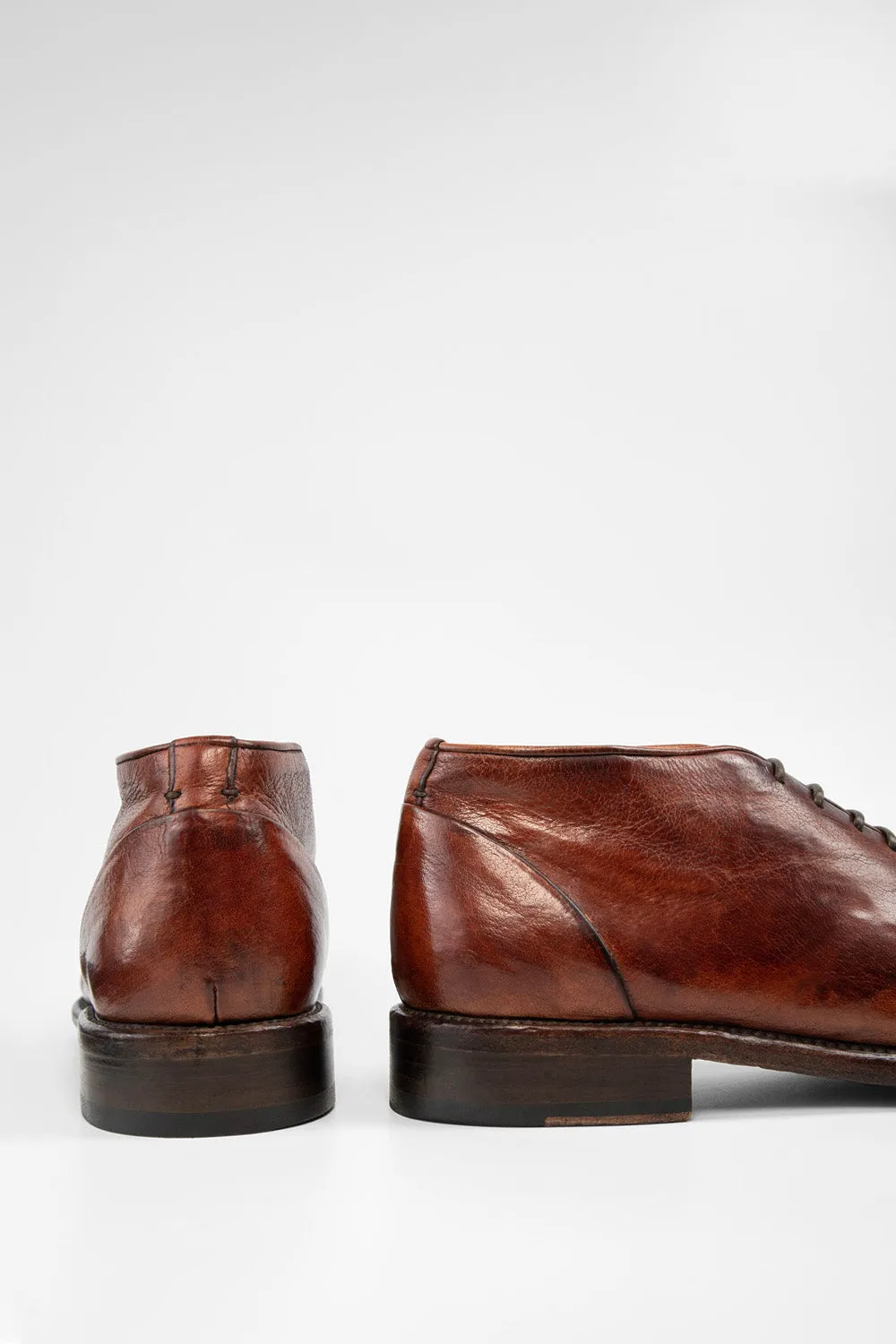 KNIGHTON rich-cognac wholecut chukka boots.