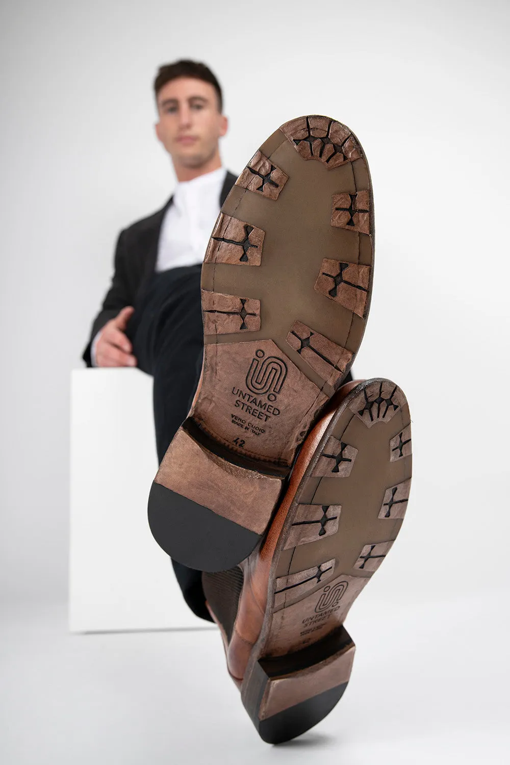 KNIGHTON rich-cognac wholecut chukka boots.