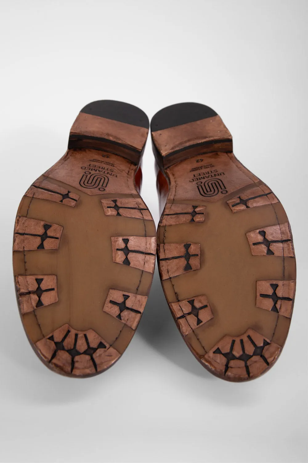 KNIGHTON rich-cognac wholecut chukka boots.