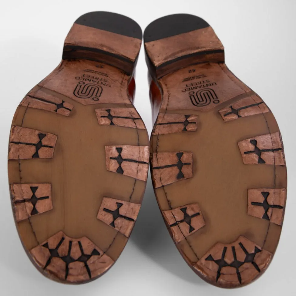 KNIGHTON rich-cognac wholecut chukka boots.